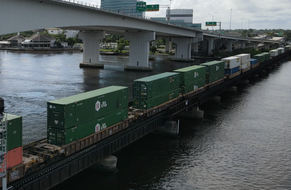 Shipping containers over water rail